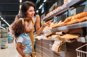 Woman and child buying groceries
